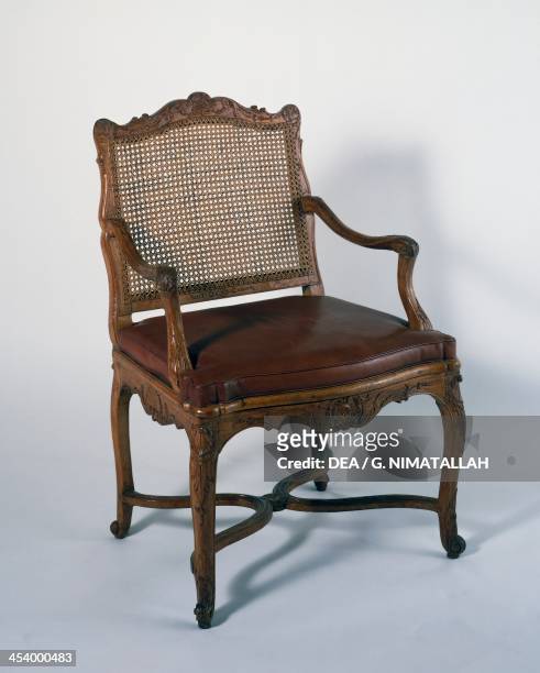 Regency style armchair with wicker backrest. France, 18th century.