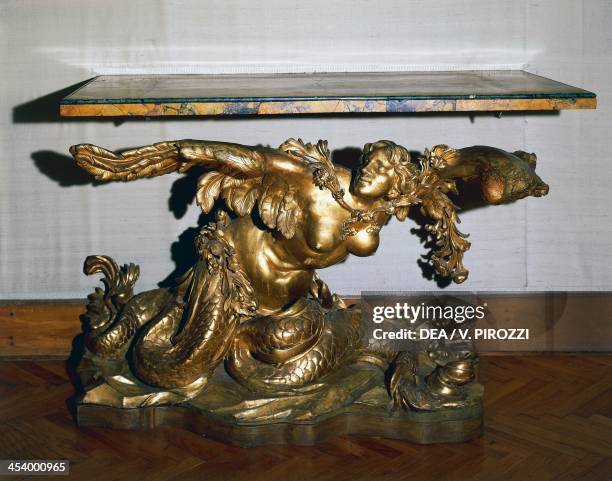 Baroque style carved and gilt walnut console table with Naiad figure, antique yellow marble top. Italy, 17th century. Roma, Museo Capitolino