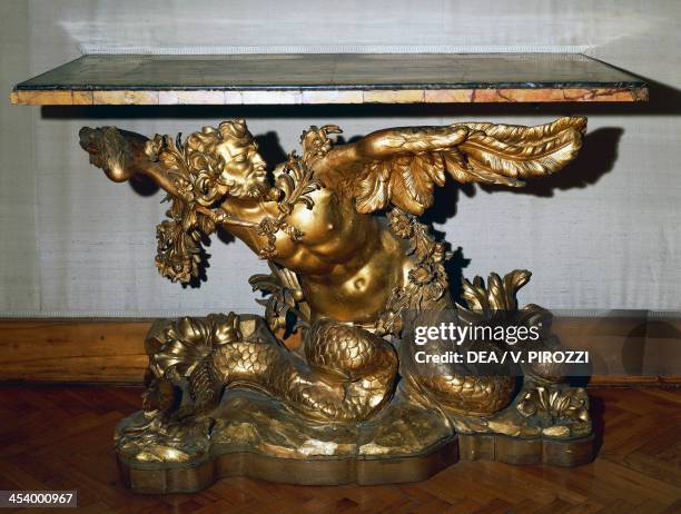 Baroque style carved and gilt walnut console table with Naiad figure, antique yellow marble top. Italy, 17th century. Roma, Museo Capitolino