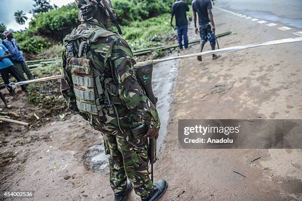 Security force of Sierra Leone stands guard at the check point due to current Ebola outbreak in Kenema eastern province of Sierra Leone on August 23,...