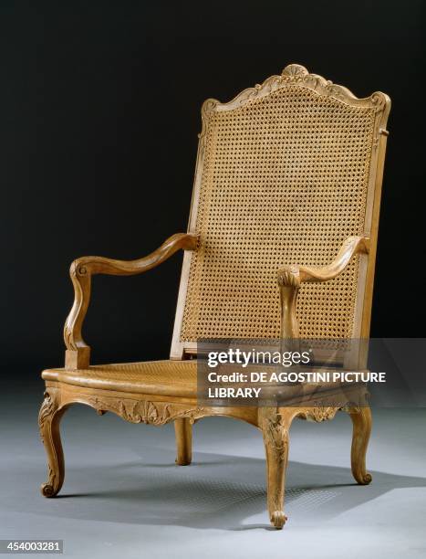 Regency style carved chair with wicker seat and back. France, 18th century.