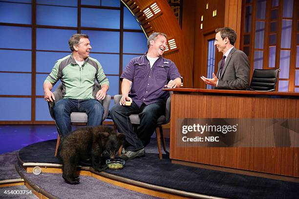 Episode 066 -- Pictured: Chris Kratt and Martin Kratt of Kratts' Creatures bring a baby black bear to an interview with host Seth Meyers on July 8,...