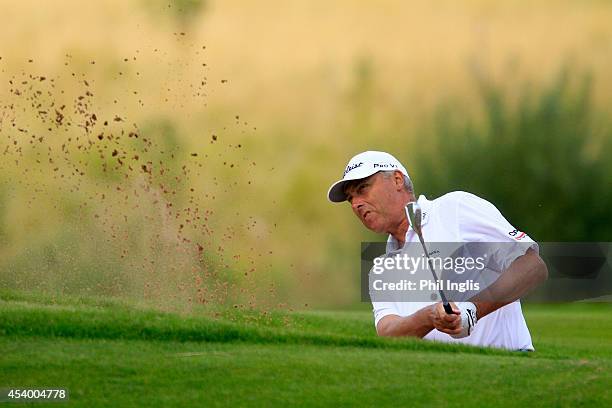 Mike Harwood of Australia in action during the second round of the English Senior Open played at Rockliffe Hall on August 23, 2014 in Durham, United...