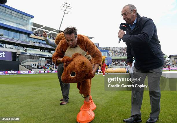 Former England captain Michael Vaughan is interviewed by David Lloyd as he takes part in the mascot race during Natwest T20 finals day at Edgbaston...