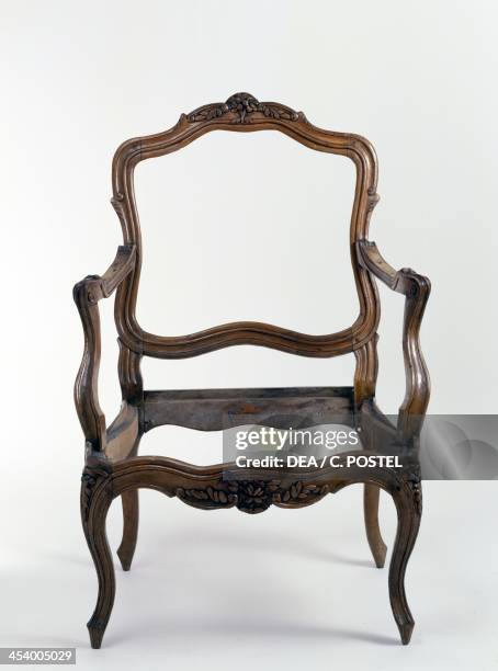 Louis XV style walnut armchair frame, stamped Nogaret. France, 18th century.