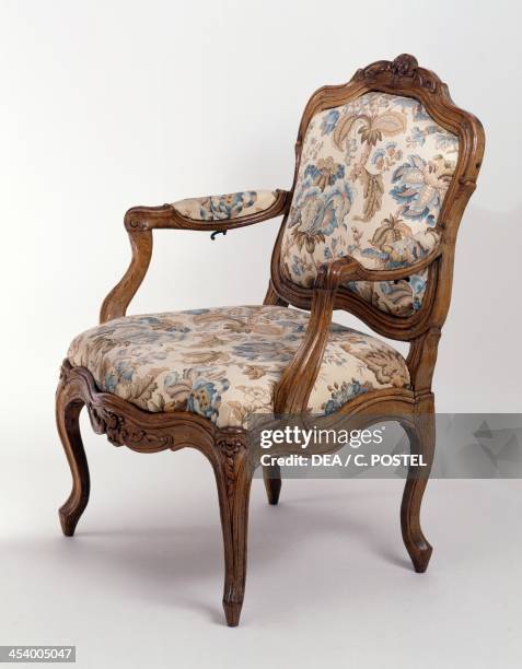 Louis XV style walnut armchair, stamped Nogaret. France, 18th century.