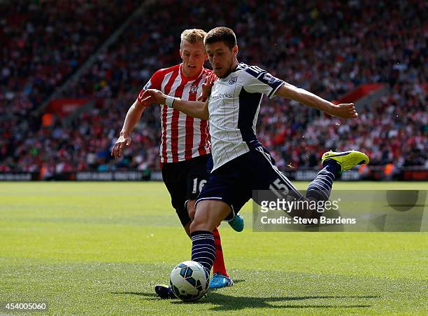 James Ward-Prowse of Southampton and Sebastien Pocognoli of West Brom battle for the ball during the Barclays Premier League match between...