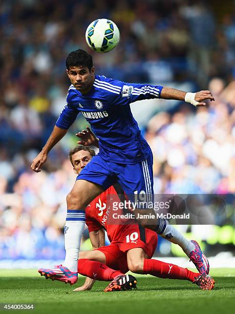 Diego Costa of Chelsea holds off Andy King of Leicester City during the Barclays Premier League match between Chelsea and Leicester City at Stamford...