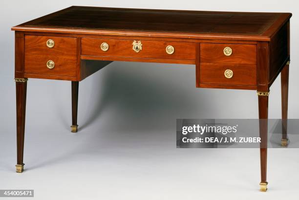 Louis XVI style mahogany writing desk with leather covered top and bronze decoration. France, 18th century.