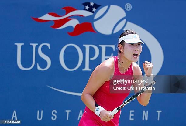 Ying-Ying Duan of China celebrates against Irena Pavlovic of France during their Women's Qualifying Singles Round 3 match prior to the start of the...