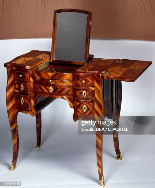 Louis XV style oak dressing table with satinwood veneer finish, triple panel top, stamped M Crieard, mirror open. France, 18th century.