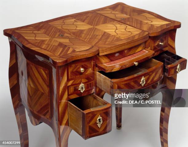 Louis XV style oak dressing table with satinwood veneer finish, triple panel top, stamped M Crieard, drawers open. France, 18th century.