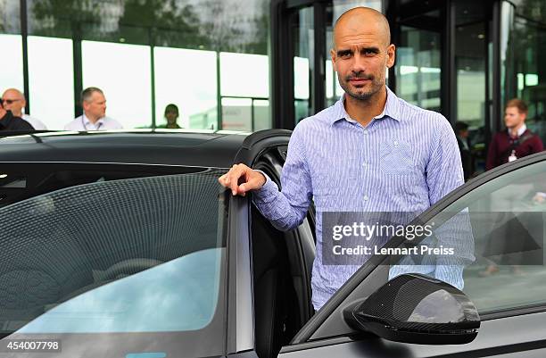 Josep Guardiola, head coach of FC Bayern Muenchen poses with his car during the car handover of Audi on August 23, 2014 in Neuburg an der Donau,...