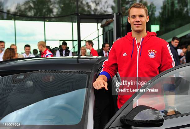 Manuel Neuer of FC Bayern Muenchen poses with his car during the car handover of Audi on August 23, 2014 in Neuburg an der Donau, Germany.