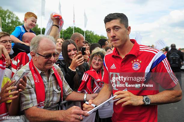 Robert Lewandowski of FC Bayern Muenchen signs autographs during the car handover of Audi on August 23, 2014 in Neuburg an der Donau, Germany.