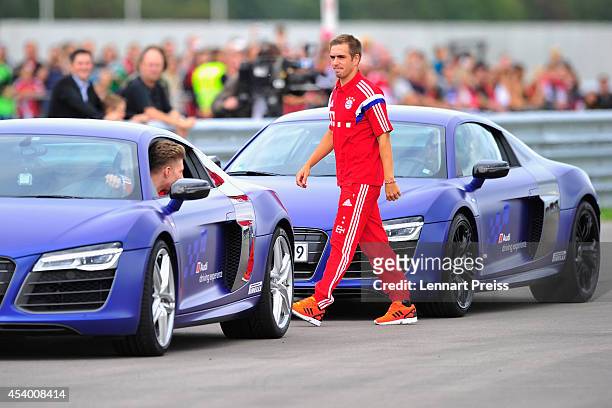 Philipp Lahm of FC Bayern Muenchen attends a driving lesson during the car handover of Audi on August 23, 2014 in Neuburg an der Donau, Germany.
