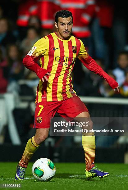 Pedro of Barcelona runs with the ball during the Copa del Rey Round of 32 match between FC Cartagena and FC Barcelona at Estadio Cartagonova on...