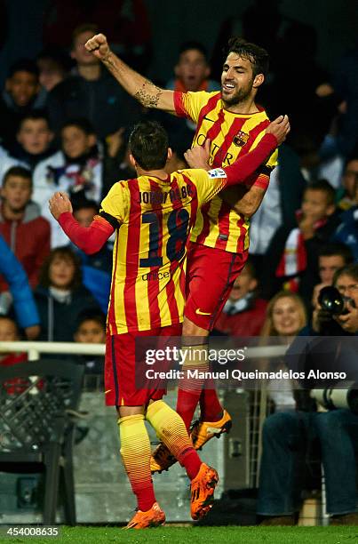 Cesc Fabregas of Barcelona celebrates after scoring with his teammate Jordi Alba during the Copa del Rey Round of 32 match between FC Cartagena and...