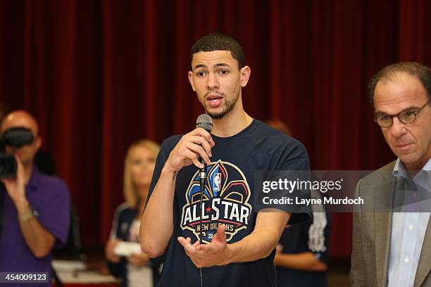 Austin Rivers of the New Orleans Pelicans speaks to elementary students and then gives each student tickets to the NBA All-Star Jam Session taking...