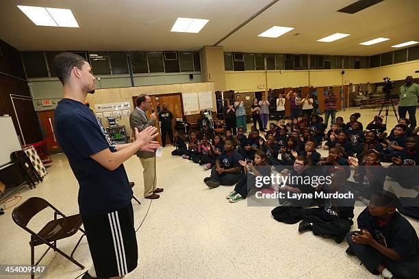 Austin Rivers of the New Orleans Pelicans speaks to elementary students and then gives each student tickets to the NBA All-Star Jam Session taking...