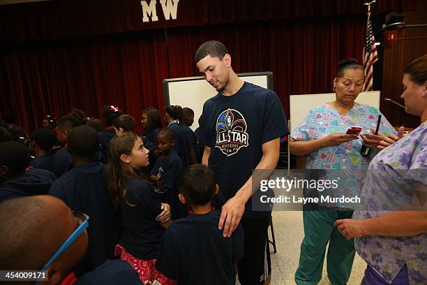Austin Rivers of the New Orleans Pelicans speaks to elementary students and then gives each student tickets to the NBA All-Star Jam Session taking...
