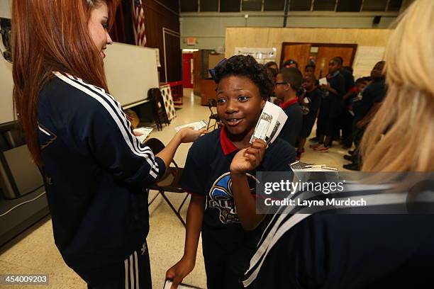 Austin Rivers of the New Orleans Pelicans speaks to elementary students and then gives each student tickets to the NBA All-Star Jam Session taking...