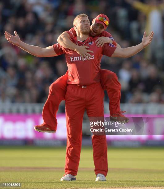 Andrew Flintoff of Lancashire celebrates with Paul Horton after dismissing Ian Bell of Birmingham Bears during the Natwest T20 Blast final between...