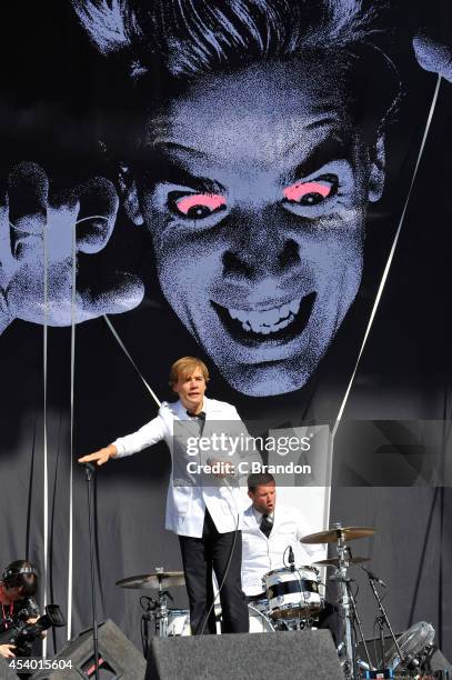 Howlin' Pelle Almqvist of The Hives performs on stage at the Reading Festival at Richfield Avenue on August 23, 2014 in Reading, United Kingdom.