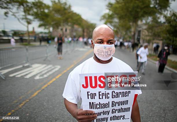 Al Smoot marches during a rally against police violence on August 23, 2014 in the Staten Island borough of New York City. Thousands of marchers are...