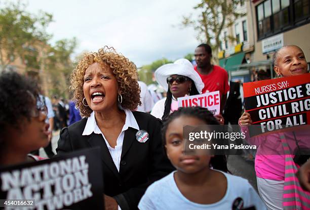 People march during a rally against police violence on August 23, 2014 in the Staten Island borough of New York City. Thousands of marchers are...