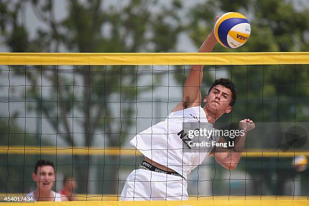 Moore and Robinson of New Zealand compete during their match against Rudolf and Stadie of Germany in Beach Volleyball Men Pool B match during the...