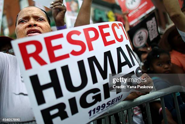 Mary Thurman prepares to march in a rally against police violence on August 23, 2014 in the Staten Island borough of New York City. Thousands of...