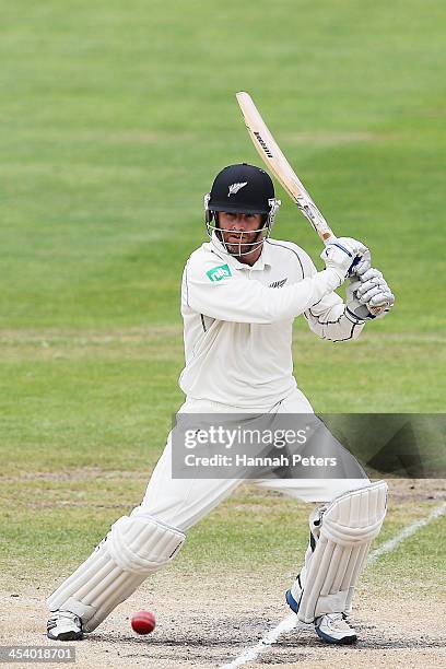 Aaron Redmond of New Zealand cuts the ball away during day five of the first test match between New Zealand and the West Indies at University Oval on...