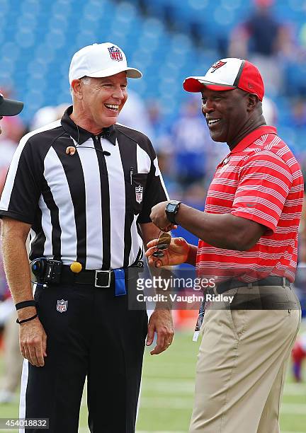 Referee Terry McAulay talks to head coach Lovie Smith of the Tampa Bay Buccaneers before the game against the Buffalo Bills at Ralph Wilson Stadium...