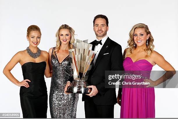 Brooke Werner, Kim Coon and Jaclyn Roney pose with NASCAR Sprint Cup Series Champion Jimmie Johnson pose for a portrait prior to the NASCAR Sprint...