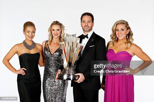 Miss Sprint Brooke Werner, Kim Coon and Jaclyn Roney pose with NASCAR Sprint Cup Series Champion Jimmie Johnson pose for a portrait prior to the...