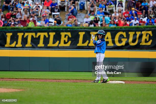 Drew Laspaluto of of the West Team from Las Vegas, Nevada celebrates after hitting a three run RBI double against the Great Lakes Team from Chicago,...