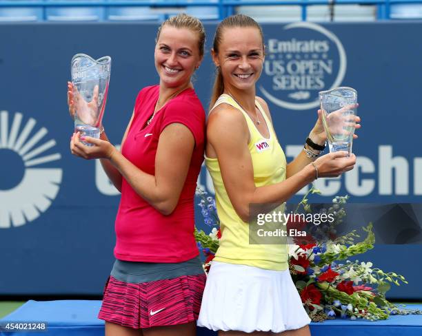 Petra Kvitova of the Czech Republic and Magdalena Rybarikova of Slovakia pose with their trophies after the women's final of the Connecticut Open at...