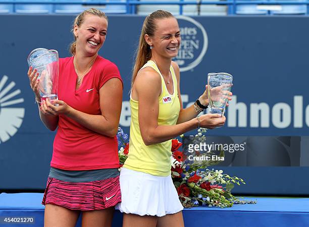 Petra Kvitova of the Czech Republic and Magdalena Rybarikova of Slovakia share a laught as they pose with their trophies after the women's final of...