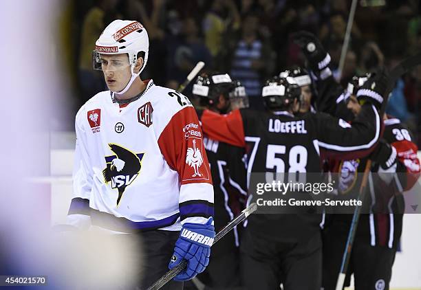 Players of Geneve-Servette are celebrating a goal while Adis Alagic of Villach SV looks disappointed during the Champions Hockey League group stage...