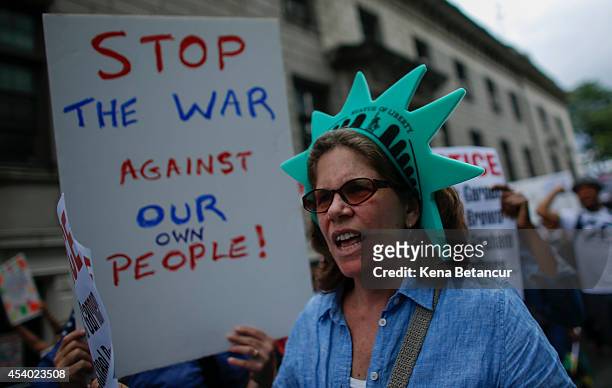 People march during rally against police violence on August 23, 2014 in the borough of Staten Island in New York City. Thousands of marchers are...
