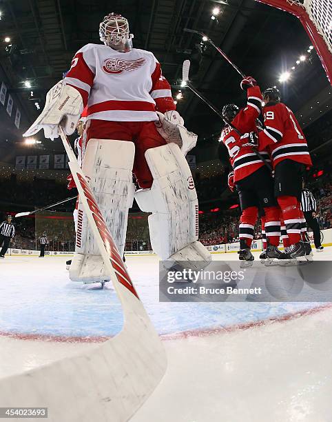 Andy Greene of the New Jersey Devils celebrates a first period goal against Jonas Gustavsson of the Detroit Red Wings at the Prudential Center on...