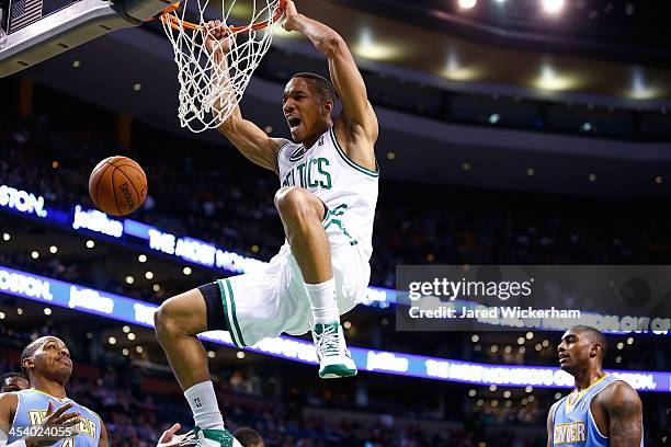 Avery Bradley of the Boston Celtics dunks the ball against the Denver Nuggets in the second quarter during the game at TD Garden on December 6, 2013...