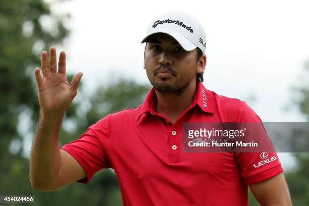 Jason Day of Australia reacts after putting for birdie on the 18th green during the third round of The Barclays at The Ridgewood Country Club on...