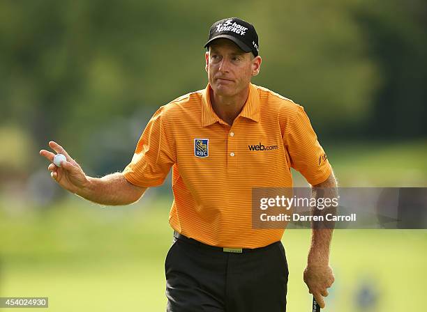 Jim Furyk reacts after putting for par on the 14th green during the third round of The Barclays at The Ridgewood Country Club on August 23, 2014 in...