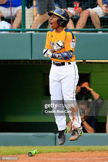 Brandon Green of the Great Lakes Team from Chicago, Illinois celebrates after scoring a run in the fifth inning against the West Team from Las Vegas,...