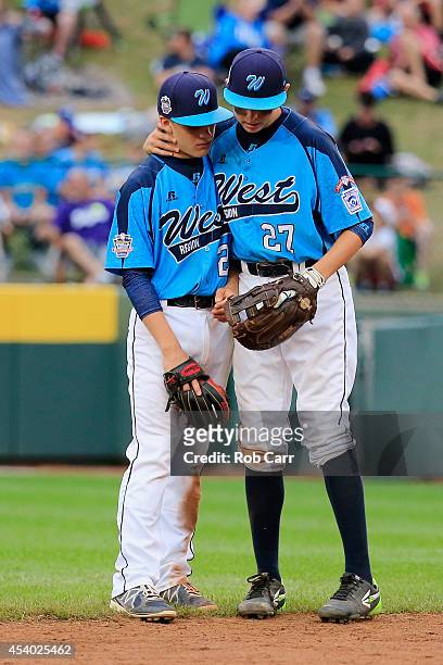 Austin Kryszczuk is consoled by Brennan Holligan of the West Team from Las Vegas, Nevada after the Great Lakes Team from Chicago, Illinois scored a...