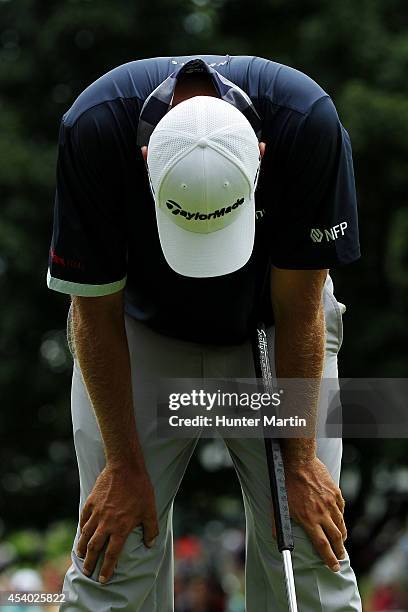 Bo Van Pelt reacts after finishing on the 18th green during the third round of The Barclays at The Ridgewood Country Club on August 23, 2014 in...