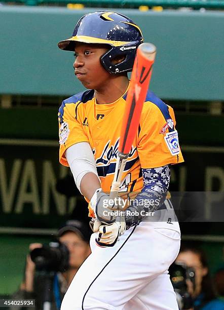 Brandon Green of the Great Lakes Team from Chicago, Illinois follows his RBI hit against the West Team from Las Vegas, Nevada against during fifth...