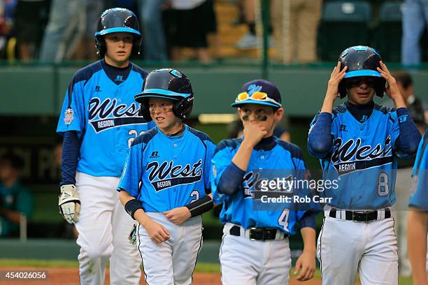 Members of the West Team from Las Vegas, Nevada walk off the field following their 7-5 loss to the Great Lakes Team from Chicago, Illinois during the...